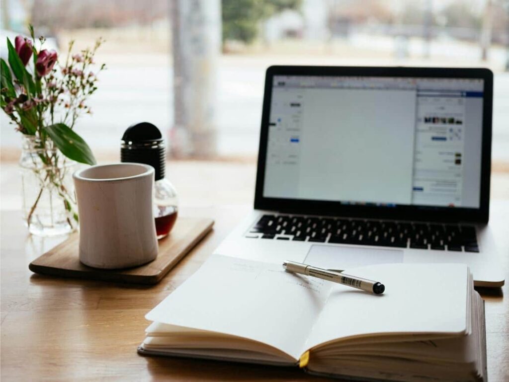 New puppy owner reading an online guide on what to look for before buying